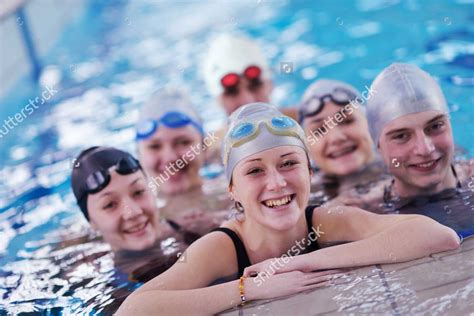 Stock Photo Happy Teen Group At Swimming Pool Class Learning To Swim