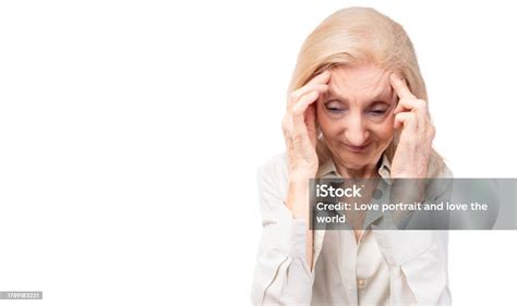 elderly woman massaging temples touching aching head feeling strong headache or migraine faint