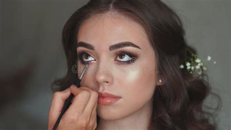 Makeup Artist Paints An Eye For A Model Girl Stock Photo Image Of