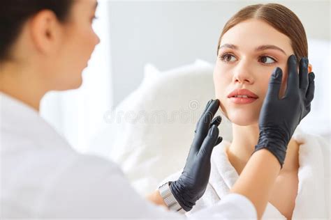 Cosmetologist In Gloves Checking Face Of Woman Stock Photo Image Of