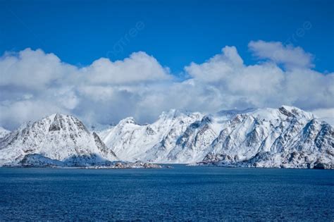 Lofoten Islands And Norwegian Sea In Winter With Snow Covered Mountains