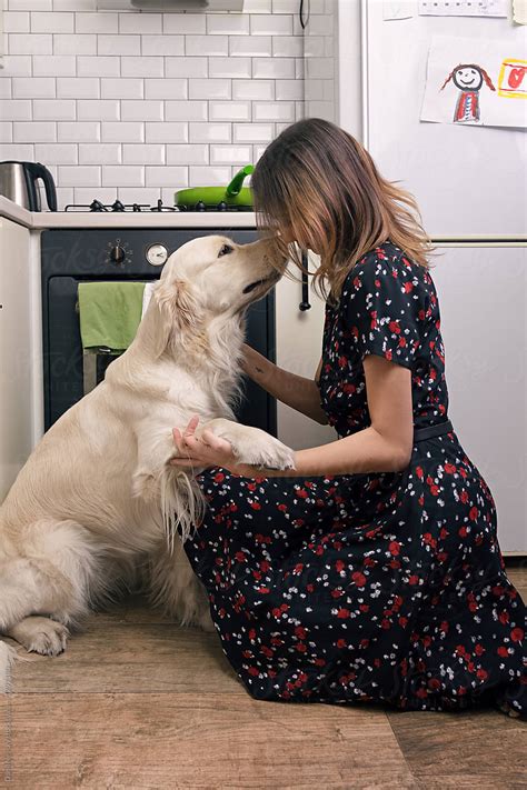 Female With Dog In The Kitchen By Stocksy Contributor Danil Nevsky
