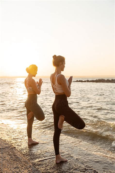 Calm Barefoot Women Standing In Balance Pose On Ocean Shore By Stocksy Contributor Milles