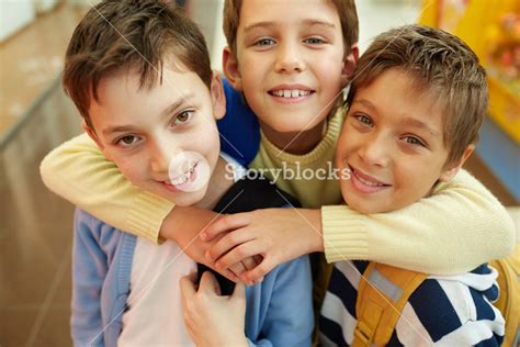 Portrait Of Three Happy Embracing Boys Royalty Free Stock Image