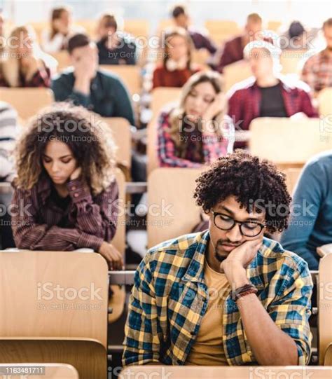 Large Group Of Bored College Students In A Lecture Hall Stock Photo