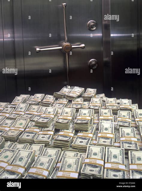 Stacks Of 10000 Us Bills In Front Of Bank Vault Door Stock Photo