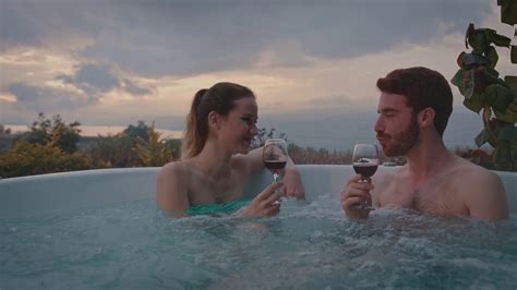Couple Drinking Wine And Blowing Kisses In A Hot Tub Stock Video Footage Artgrid Io Youtube