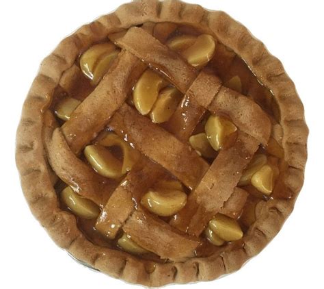 An Apple Pie Is Shown On A White Background With Some Apples In The Crust And Caramel Toppings