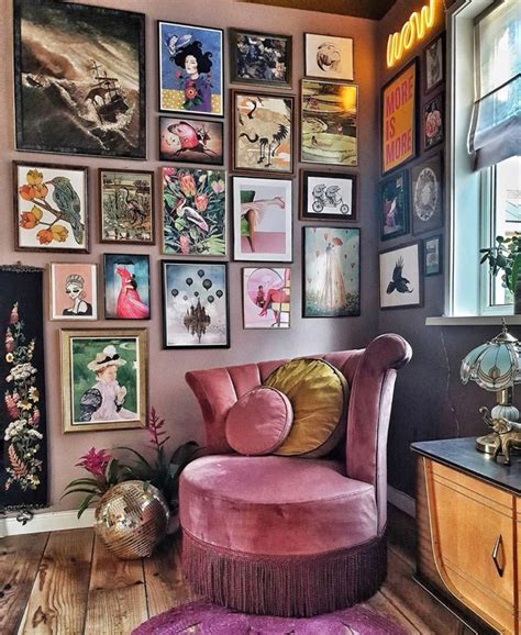 A Pink Chair Sitting In Front Of A Window Filled With Pictures On The