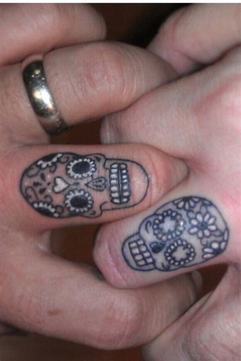 Small Sugar Skulls Tattoos On Both Fingers
