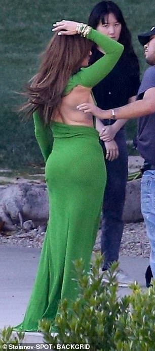 jennifer lopez flashes some serious side boob in revealing green dress during a photo shoot in