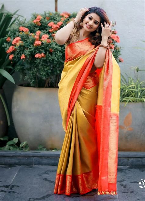 Sneha Prasanna In A Yellow Silk Saree