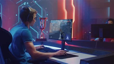 Two Professional Esport Gamers Play In A 3d Mock Up First Person