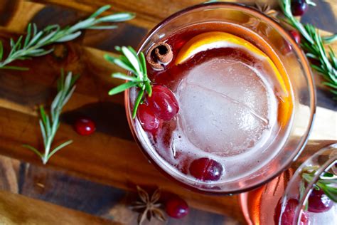 Every christmas, as soon as i put this out, everyone rushes around the punch bowl like a pack of wild animals! Holiday Bourbon Cocktail - Cooking Up Happiness