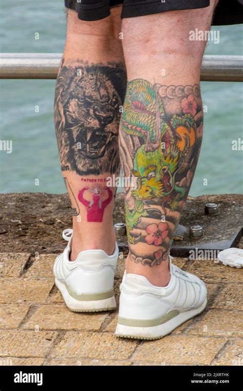 Heavily Tattooed Legs Close Up Of Mans Legs With Heavy Tattooing