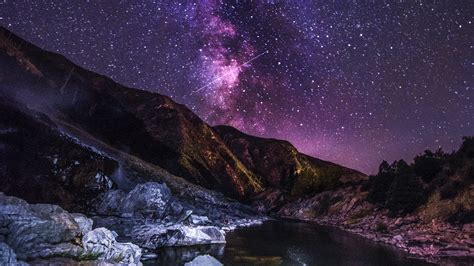 Download Starry Sky Mountains River Flow Night Wallpaper 2560x1440