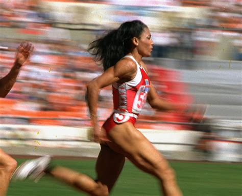 She caught the world's eye with her flashy outfits and extreme nails, but she kept their attention with her speed. FLO JO