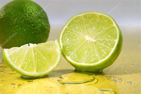 Limes On Yellow Surface Stock Photo By ©sandralise 3300070
