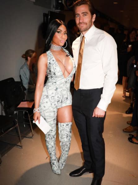 Nicki Minaj Shows Off Her Killer Cleavage As She Dresses Head To Toe In Dollar Bills To Pose