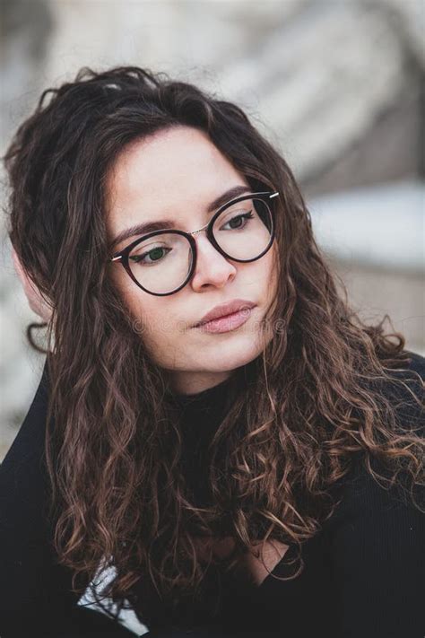 Beautiful Young Woman With Brunette Curly Hair Portrait In Eye Glasses
