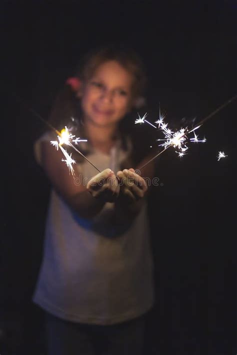 Girl Holding A Sparkler On Christmas Eve Stock Photo Image Of Bright