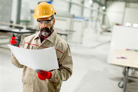 Senior Supervisor Looking At Projest In The Factory Stock Image Image