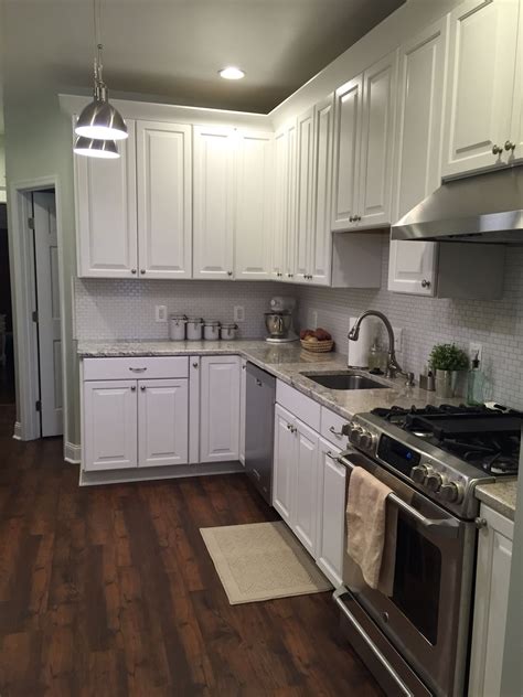 They took their time to make sure it was right and left only after cleaning their work area. American Woodmark cabinets, GE Cafe range, resilient ...