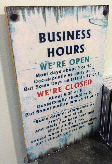 Complicated Business Hours Sign Fixtures Close Up