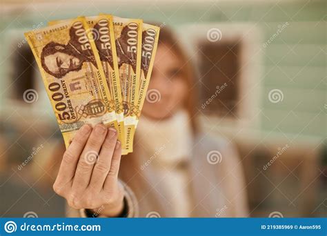 Young Redhead Girl Smiling Happy Holding Hungarian Forint Banknotes At The City Stock Image