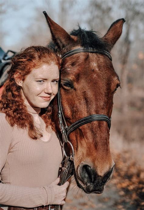 Beautiful Red Haired Woman Posing With Horse Outdoors Stock Image