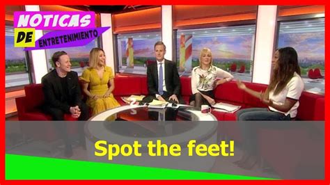 hot news spot the feet bbc breakfast floor manager tries and fails to hide behind the sofa