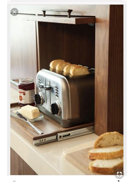 I installled this in two of my kitchen cupboards. Hidden countertop appliances: a pull-out toaster slider ...