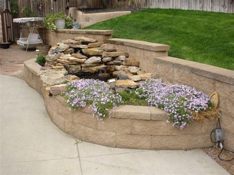 Block Retaining Wall A Raised Planter Bed And A Waterfall Built Into