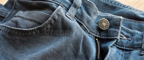 Zipper Pocket And Buttons Close Up Detail Of Light Blue Jeans Stock