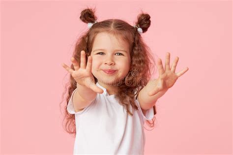 Girl Child Over Pink Looking Camera Points Hands Stock Photos Free