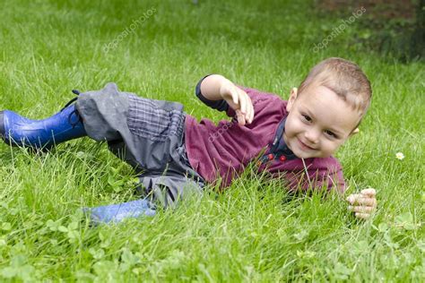 Happy Child Playing In Grass — Stock Photo © Pavsie 40946749