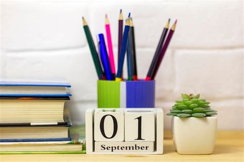 Premium Photo September 1 In A Wooden Calendar On A Table Or