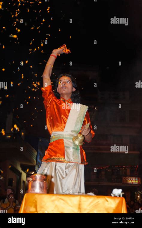 Brahman Hindu Priest Performing The Sunset Celebration To The Ganges