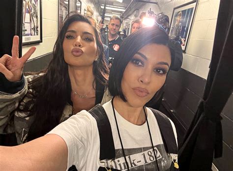 kim and kourtney kardashian hang out at blink 182 concert as feud plays out on ‘the kardashians