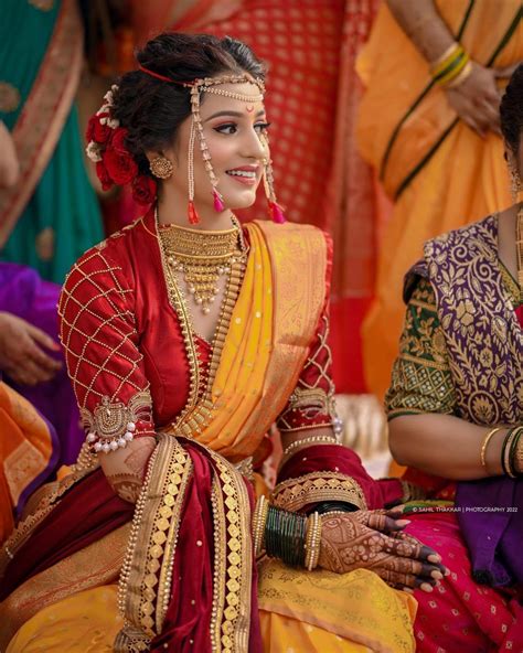 marathi bride in red and yellow saree on haldi indian bride makeup indian bride outfits indian