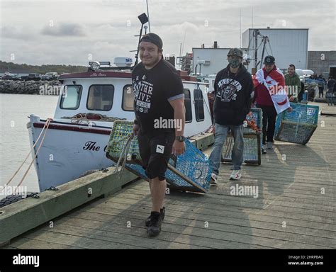 Members Of The Sipeknekatik First Nation Load Lobster Traps On The