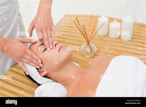 Peaceful Brunette Enjoying A Face Massage Stock Photo Alamy