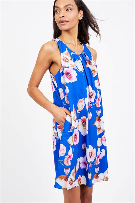 This Bold Floral Printed Shift Dress Features A Pleated Neckline And