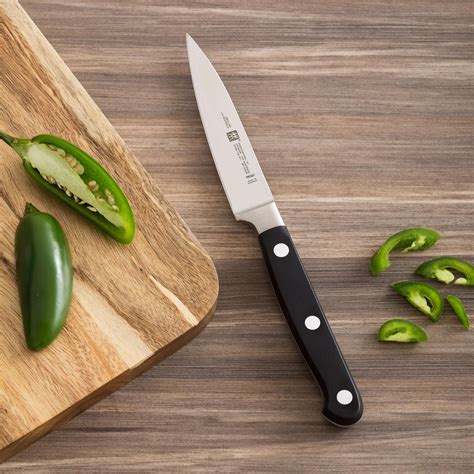 German knives have a wide blade profile that's slightly rounded to support the rock chop cutting technique and make it easy to scoop and transport the. ZWILLING® Professional 'S' 4" Paring Knife | Kitchen tops ...