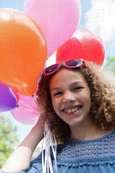 Girl Holding Balloons Stock Photo Dissolve