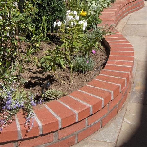 Garden edging offers many functions to your garden and to the entire aesthetic of your lawn, yards and the whole of the home, truth be told. brick-wall-garden | Wentworth Nursery Garden Center