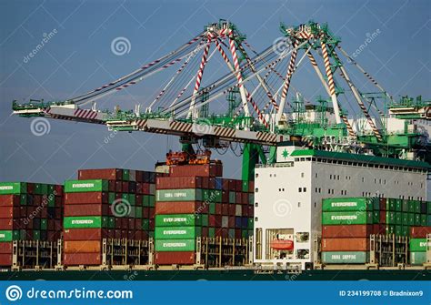Containers Being Loaded And Unloaded From A Ship In The Port Of Los