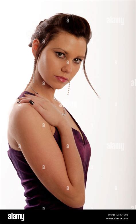 Young Beautiful Brunette Model With Her Hair Up Wearing A Purple Silk