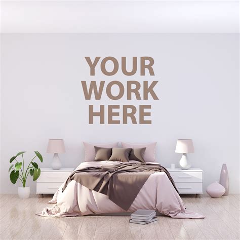 Comfortable big wooden framed bed with linen, pillows and blanket, nightstand beside and round mirror hanging on a white wall in a bright bedroom interior. 5 Square Bedroom wall frame mockups on Behance