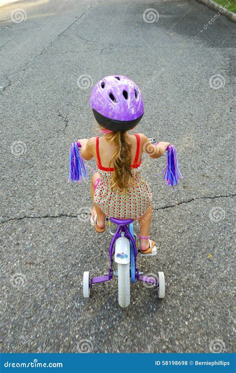 Girl Riding Bicycle With Training Wheels Stock Photo Image Of